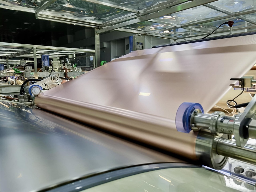 Thin copper foil running through production rollers